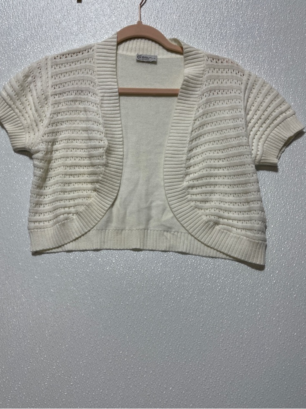 5/$25 Crocheted Open-Front Cropped Shrug in Cream by Cebrus